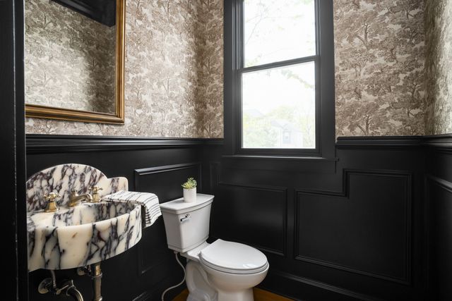 a bed room with a bed and a window