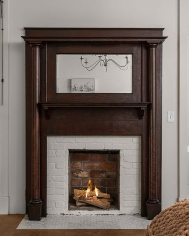a kitchen with stainless steel appliances a stove microwave and sink
