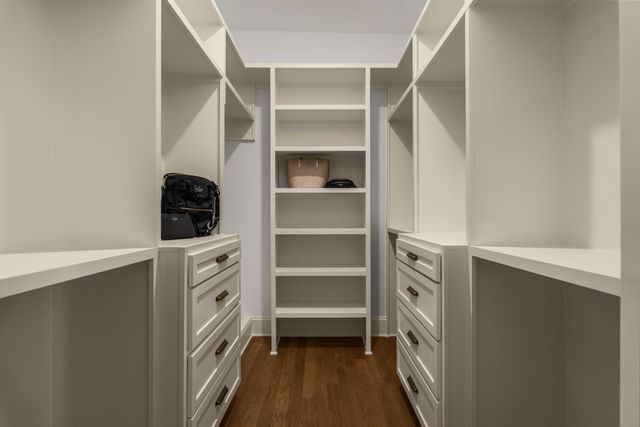 a kitchen with a sink cabinets and stainless steel appliances