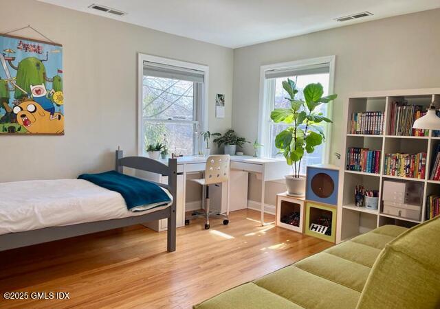 6 Irvine Road Old Greenwich, CT 06870 - Photo 12 of 15 a living room with furniture and a book shelf