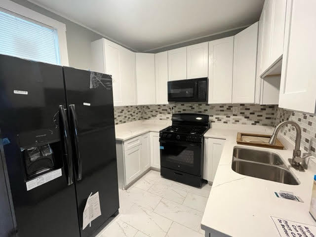 7924 South May Street, Unit 2 Chicago, IL 60620 - Photo 5 of 10 a kitchen with a sink stove and refrigerator
