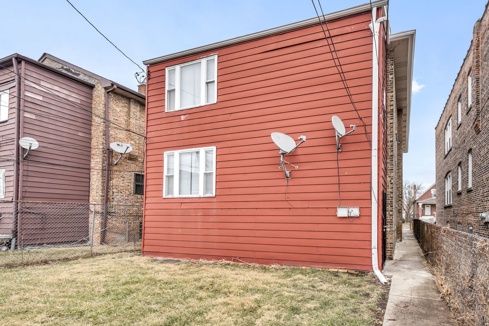 7924 South May Street, Unit 2 Chicago, IL 60620 - Photo 9 of 10 a view of a backyard with brick wall and plants