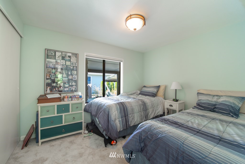 907 240th Place Southwest Bothell, WA 98021 - Photo 14 of 24 a bedroom with two beds and a window