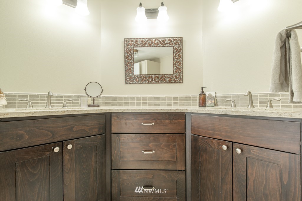 907 240th Place Southwest Bothell, WA 98021 - Photo 16 of 24 a bathroom with a sink and a mirror