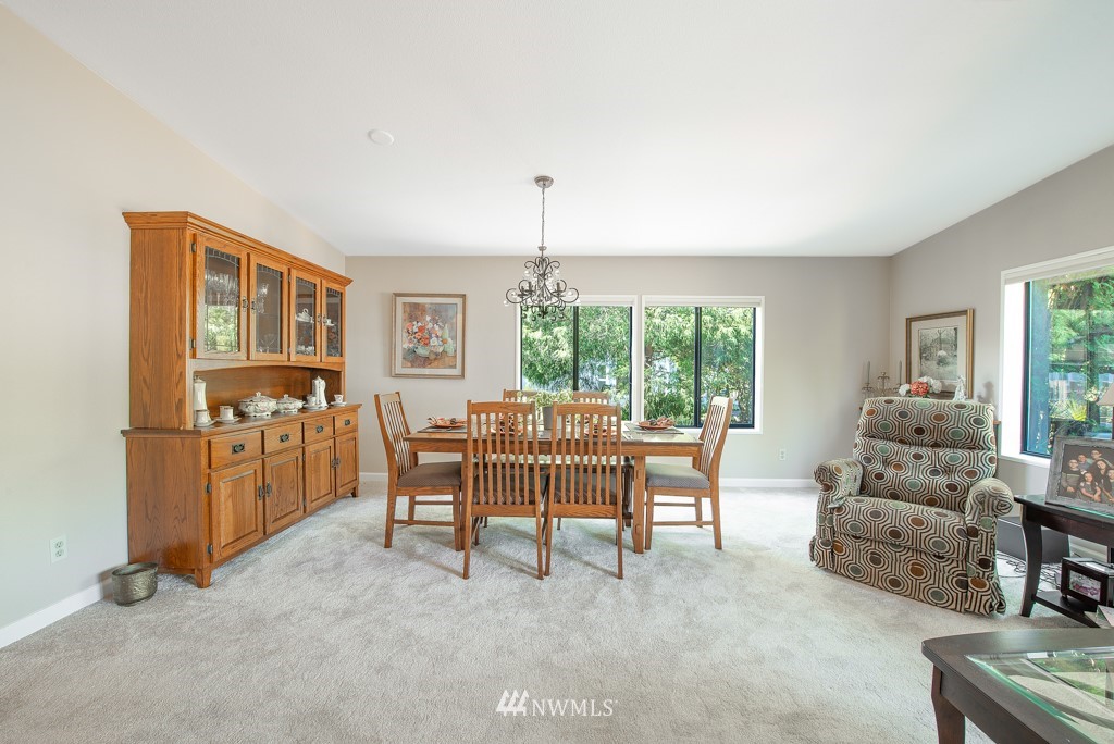 907 240th Place Southwest Bothell, WA 98021 - Photo 8 of 24 a living room with furniture and a window