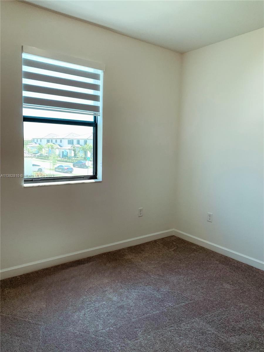 11909 Southwest 244th Street, Unit 11909 Homestead, FL 33032 - Photo 25 of 45 an empty room with a window