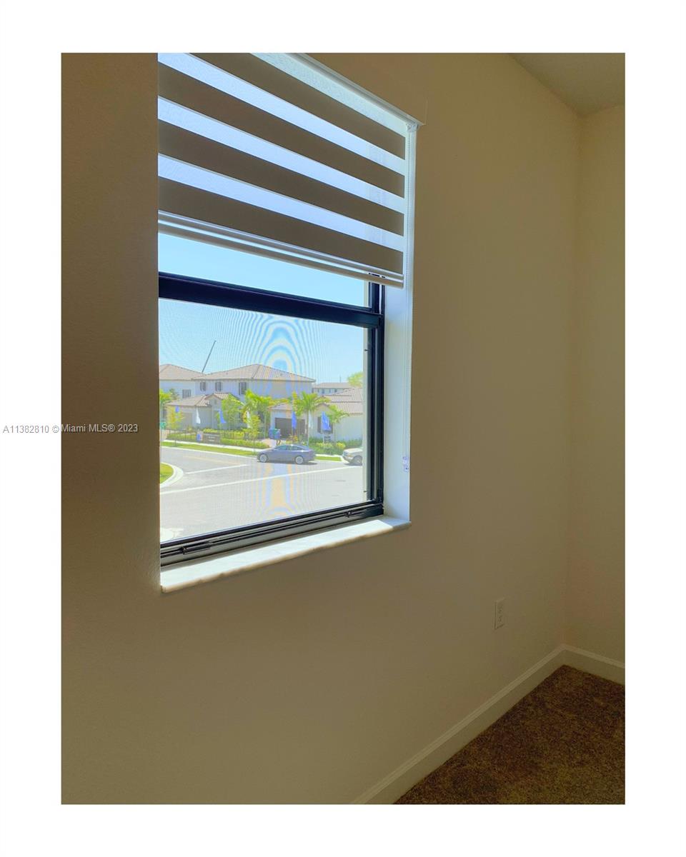 11909 Southwest 244th Street, Unit 11909 Homestead, FL 33032 - Photo 27 of 45 a view of a room that has a window