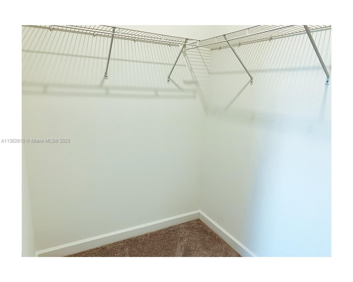 11909 Southwest 244th Street, Unit 11909 Homestead, FL 33032 - Photo 29 of 45 a view of a room with racks on the wall