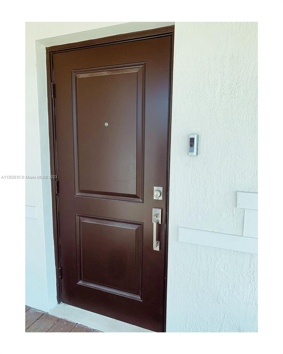 11909 Southwest 244th Street, Unit 11909 Homestead, FL 33032 - Photo 42 of 45 a picture of door of a house