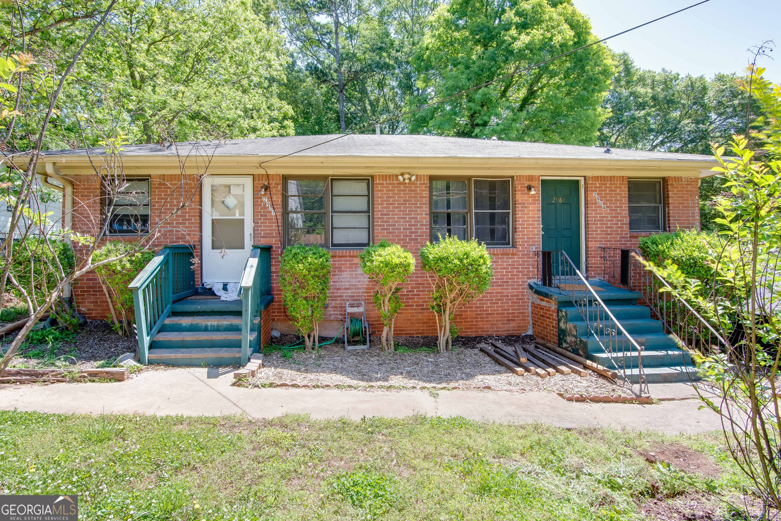 2982 Pearl Street Atlanta, GA 30344 - Photo 1 of 11 a front view of house with yard and outdoor seating