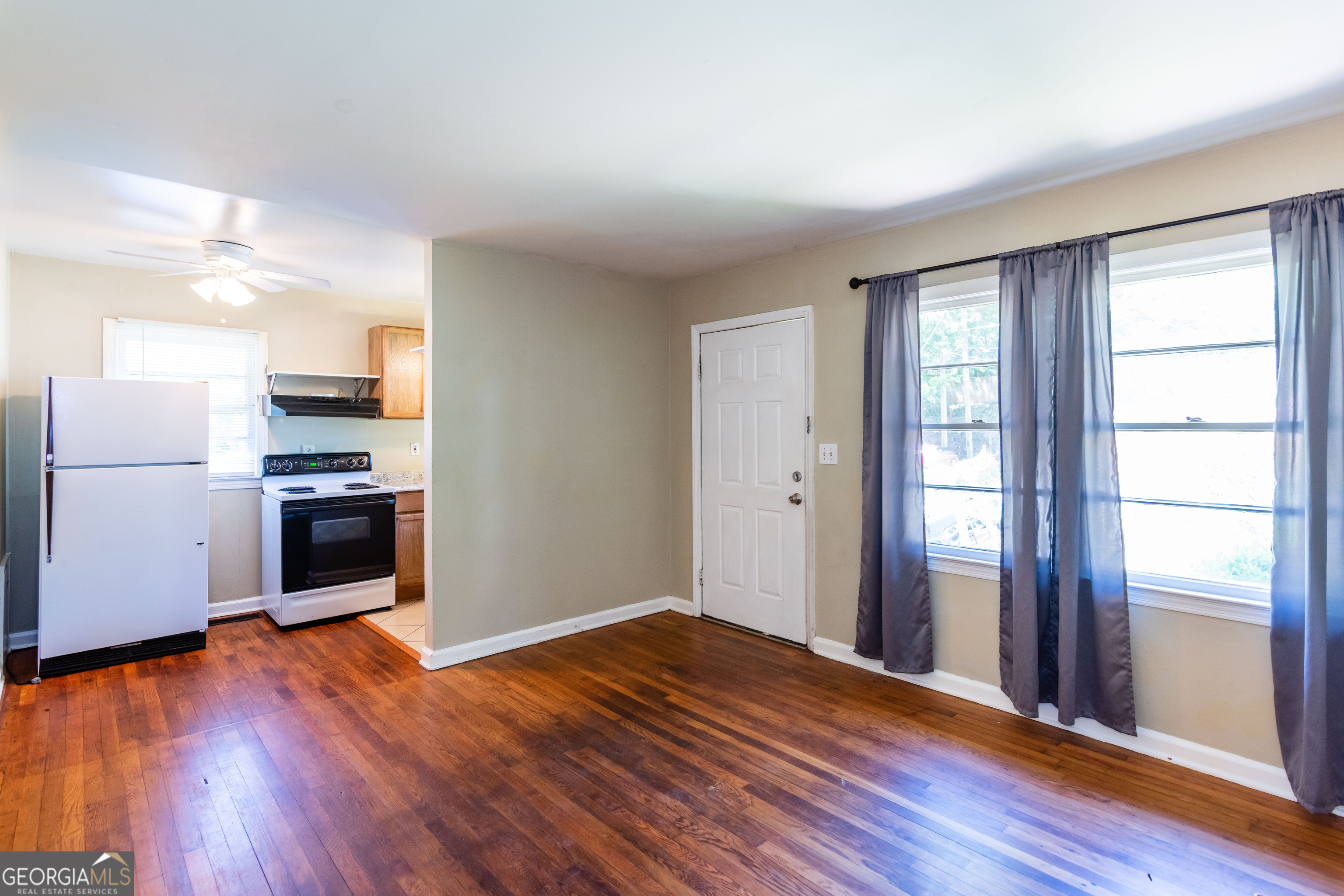 2982 Pearl Street Atlanta, GA 30344 - Photo 3 of 11 a view of kitchen with wooden floor electronic appliances and window