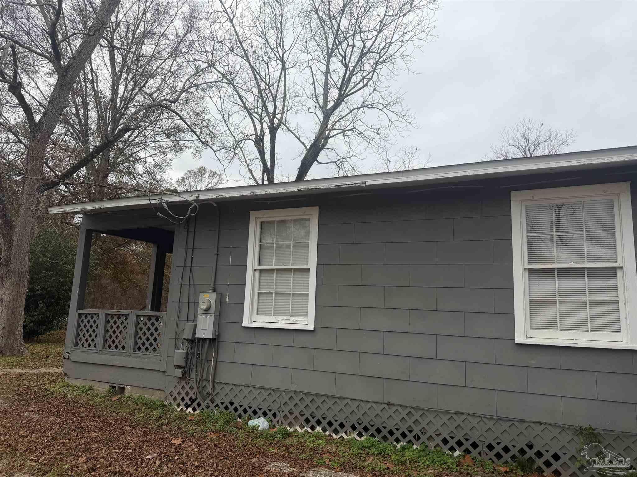102 Morris Avenue Cantonment, FL 32533 - Photo 10 of 12 a front view of a house with a yard