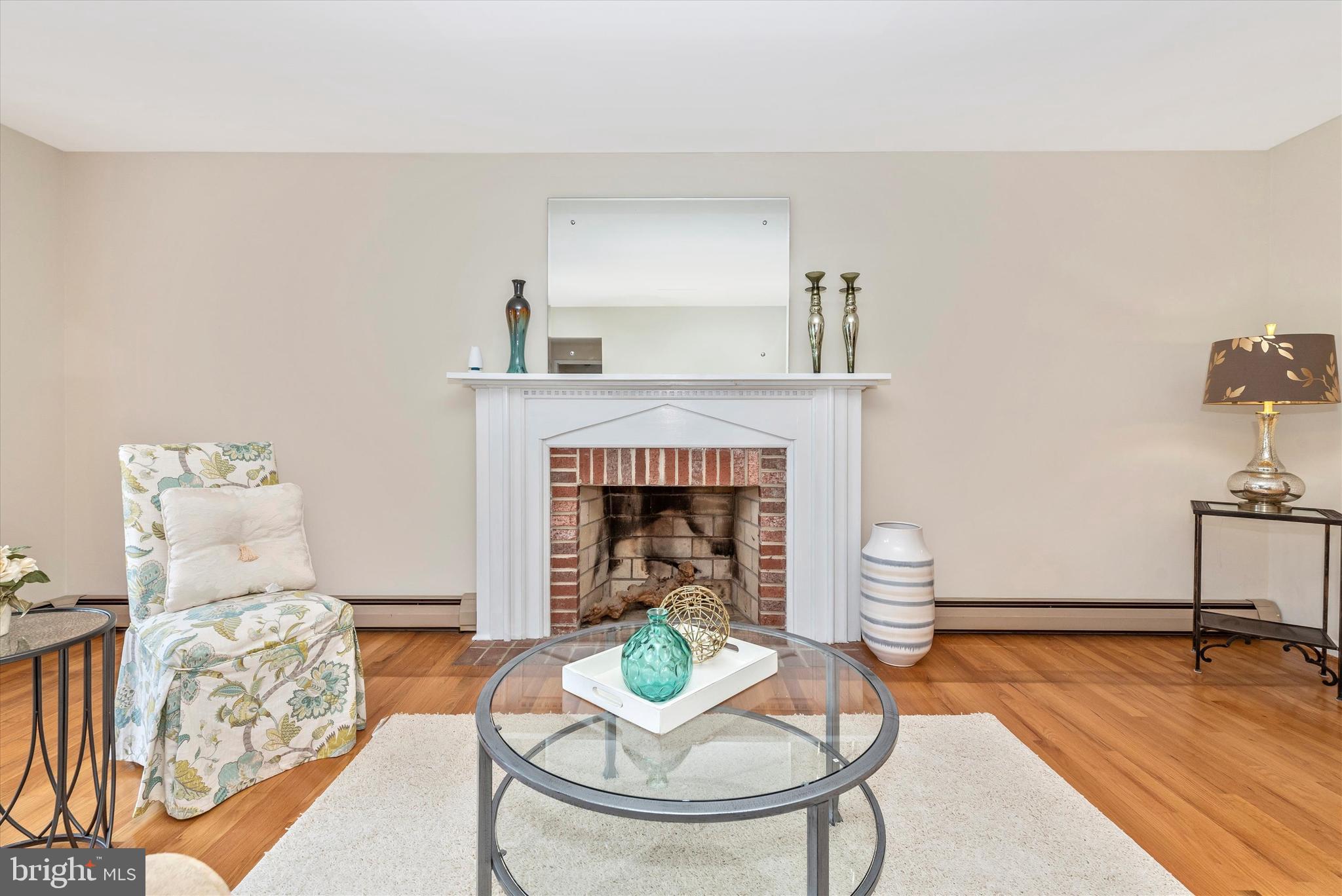 Spacious living room with wood burning fireplace