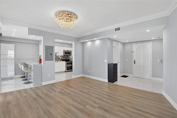 a view of a livingroom with wooden floor
