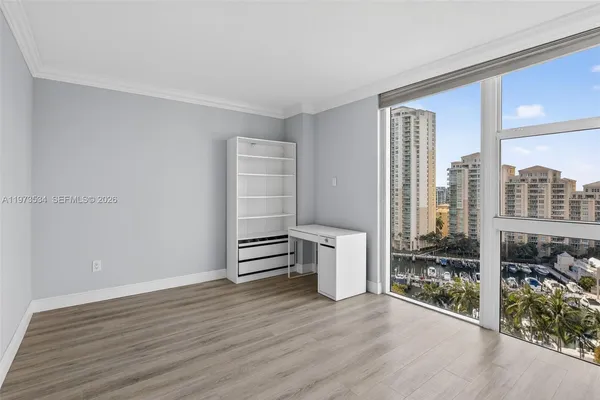 a view of walk in closet and window