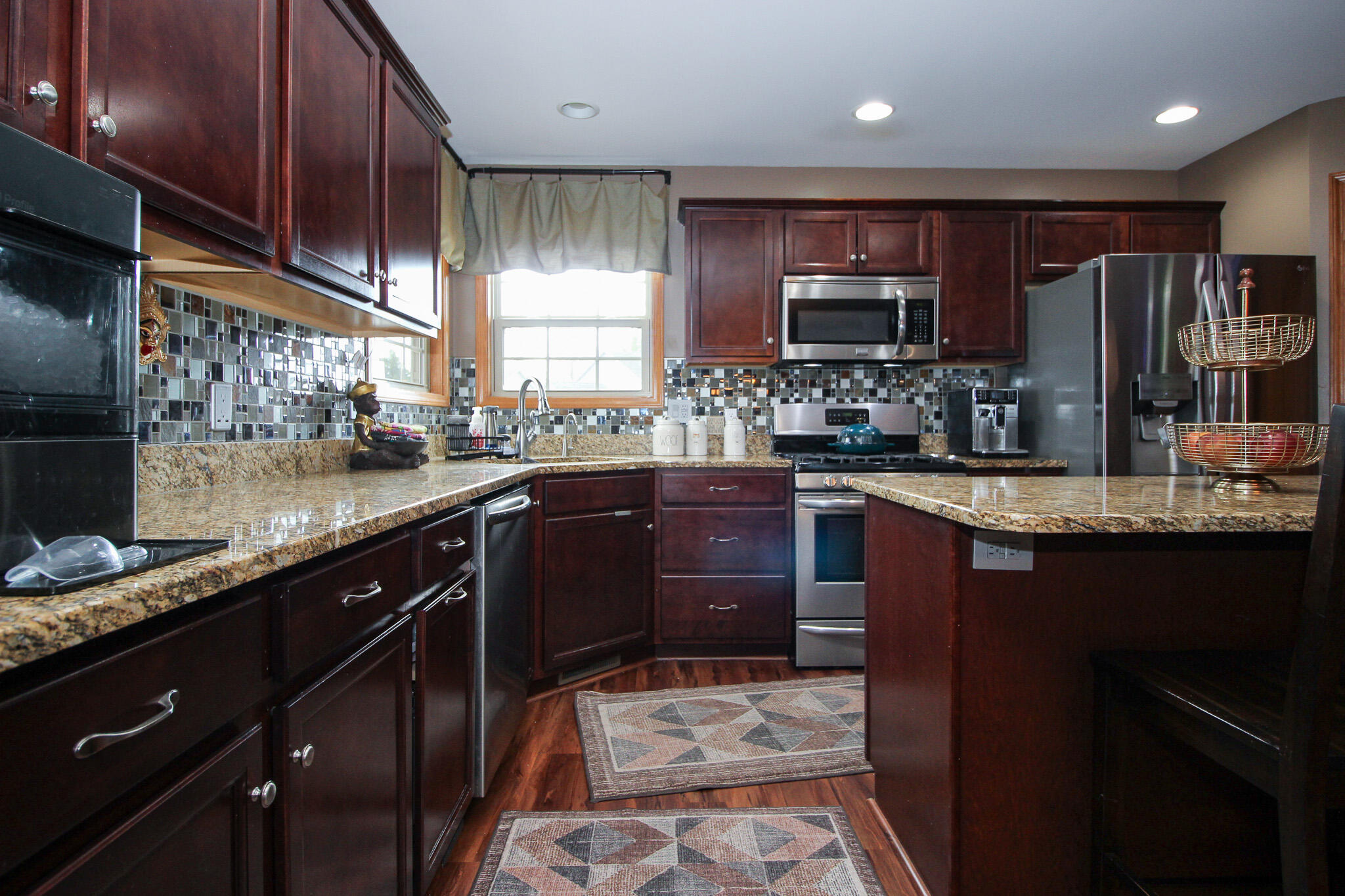 2913 Cardinal Drive Wheatfield, IN 46392 - Photo 12 of 34 a kitchen with a sink stove and refrigerator