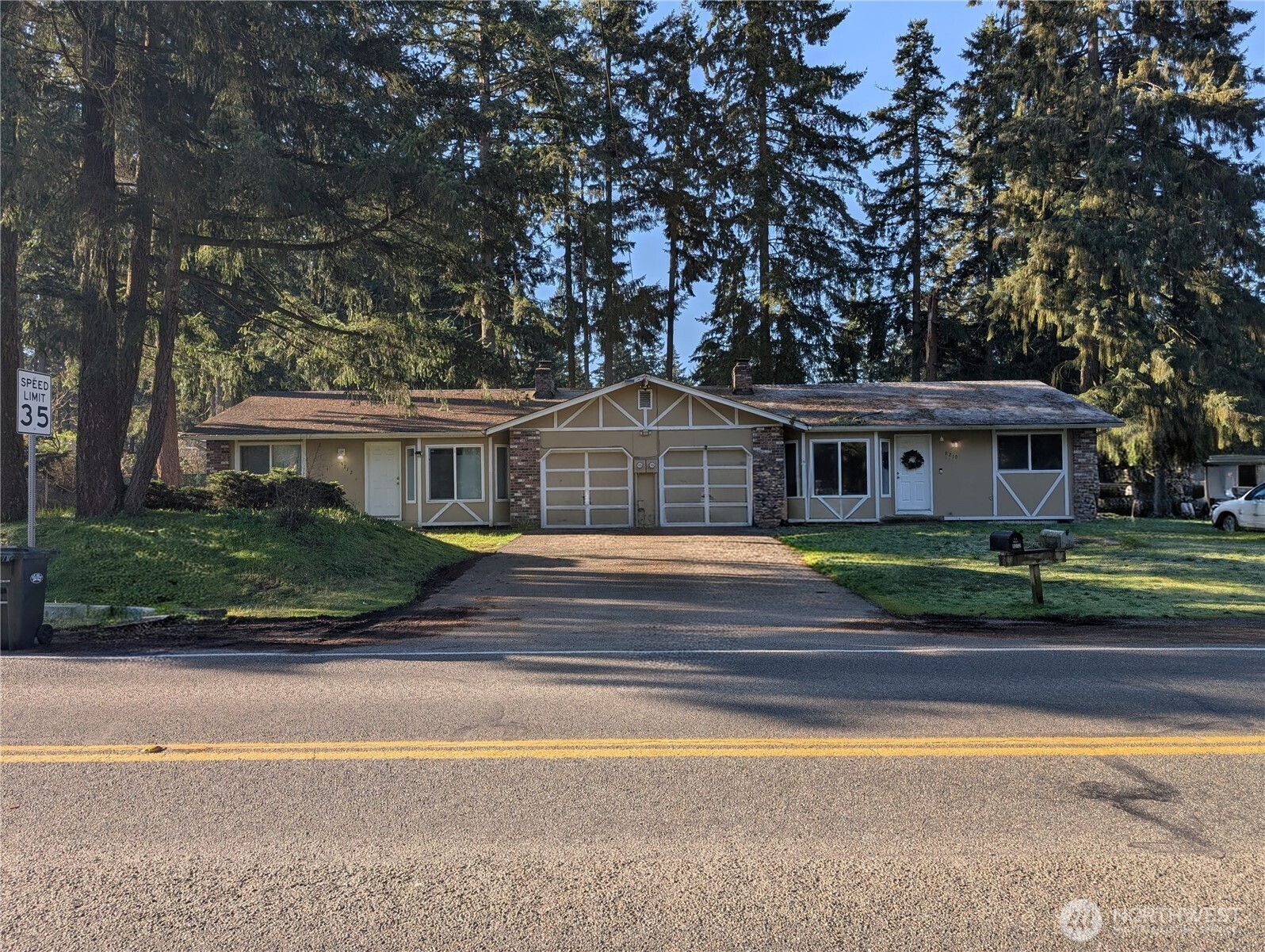 9210-9212 204th Street East Graham, WA 98338 - Photo 1 of 16 a front view of a house with a yard