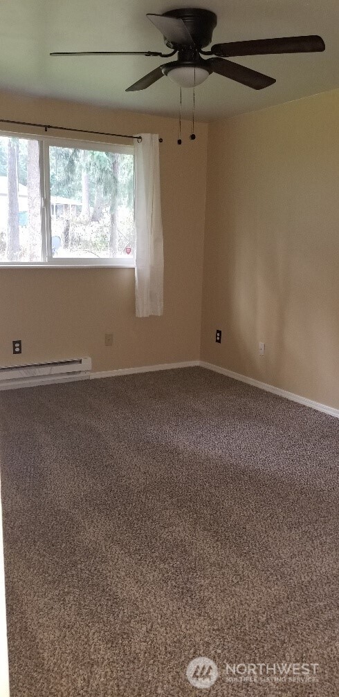 9210-9212 204th Street East Graham, WA 98338 - Photo 8 of 16 an empty room with a window