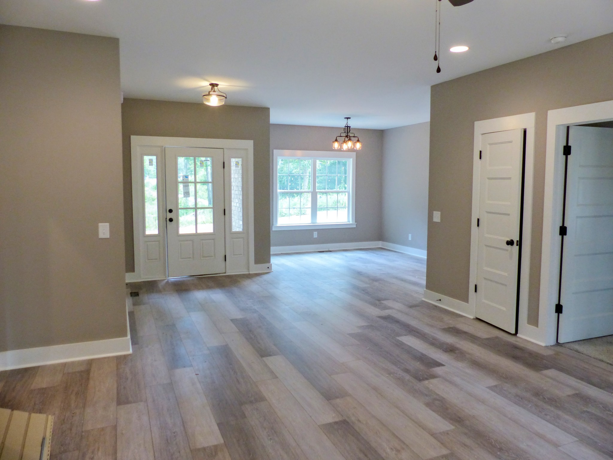 2955 Friendship Road Cross Plains, TN 37049 - Photo 3 of 12 a view of an empty room with wooden floor and a window