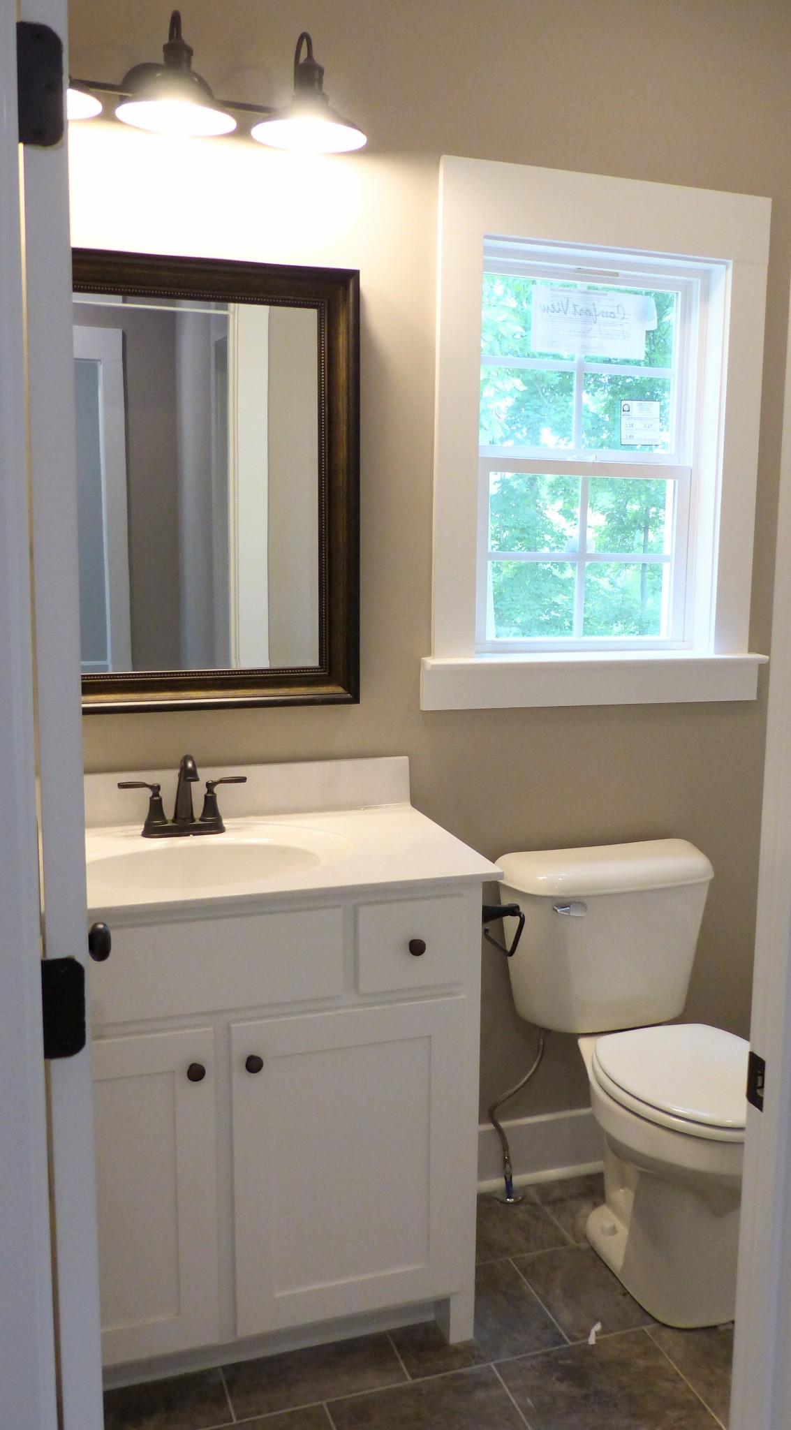 2955 Friendship Road Cross Plains, TN 37049 - Photo 10 of 12 a bathroom with a sink a toilet and a mirror