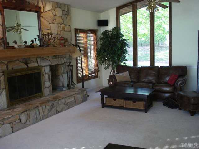 2519 Baptist Road Durham, NC 27703 - Photo 5 of 8 a living room with furniture and a fireplace