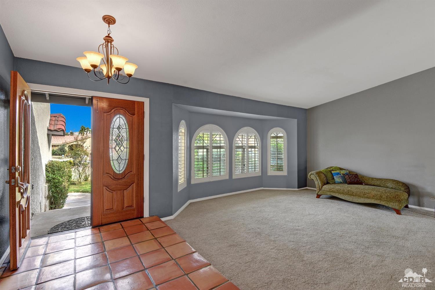 68889 Risueno Road Cathedral City, CA 92234 - Photo 2 of 29 a living room with furniture and a window