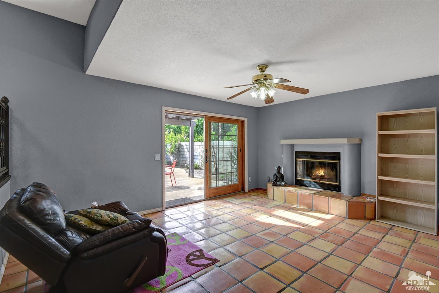 68889 Risueno Road Cathedral City, CA 92234 - Photo 11 of 29 a living room with furniture and a fireplace