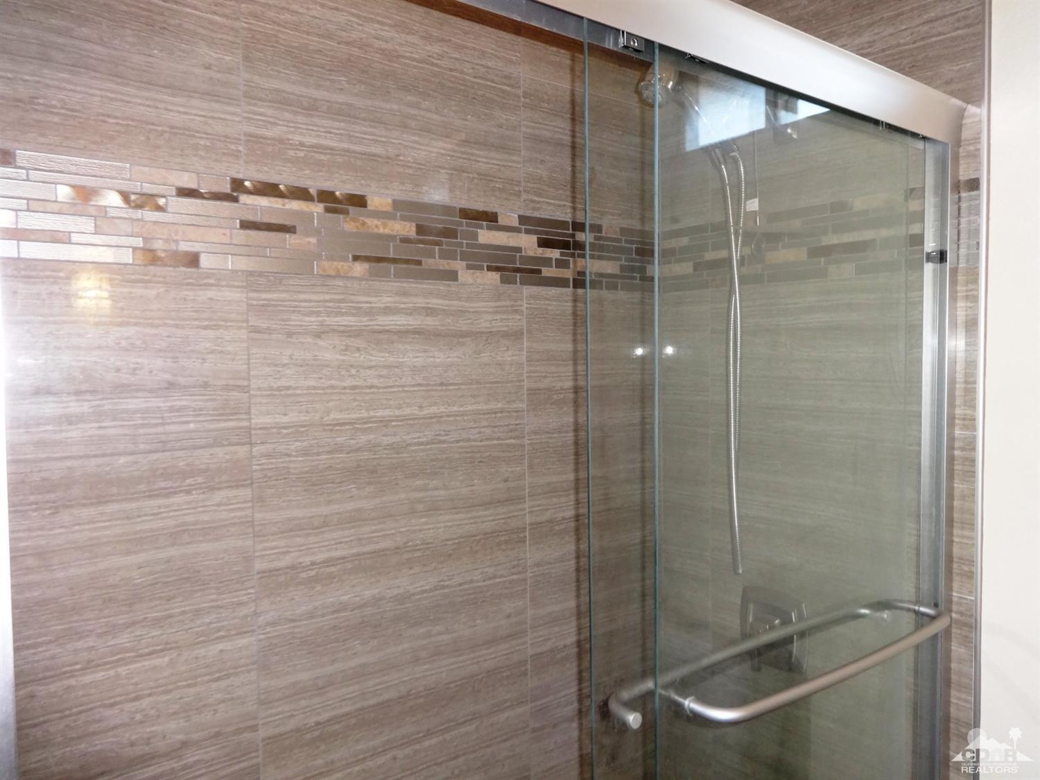 68889 Risueno Road Cathedral City, CA 92234 - Photo 24 of 29 a bathroom with a shower