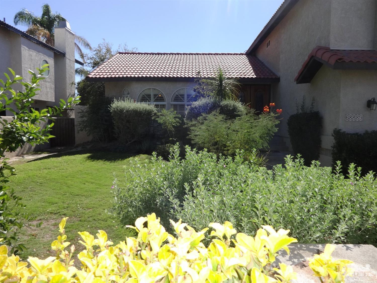 68889 Risueno Road Cathedral City, CA 92234 - Photo 27 of 29 a front view of a house with a yard