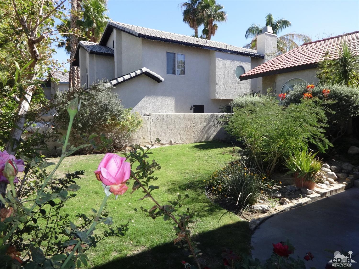 68889 Risueno Road Cathedral City, CA 92234 - Photo 28 of 29 a front view of a house with a yard