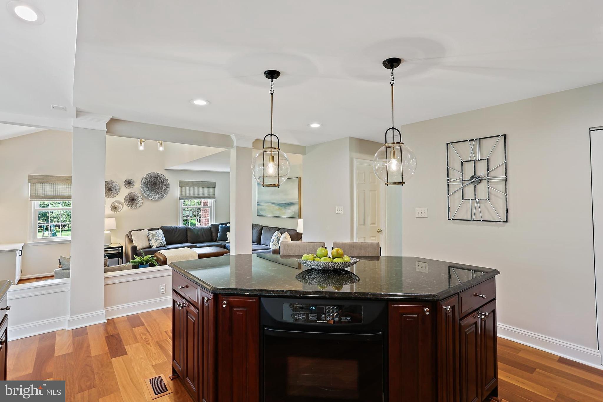 2111 Stonewall Road Baltimore, MD 21228 - Photo 12 of 58 a kitchen with a sink a counter space and living room view