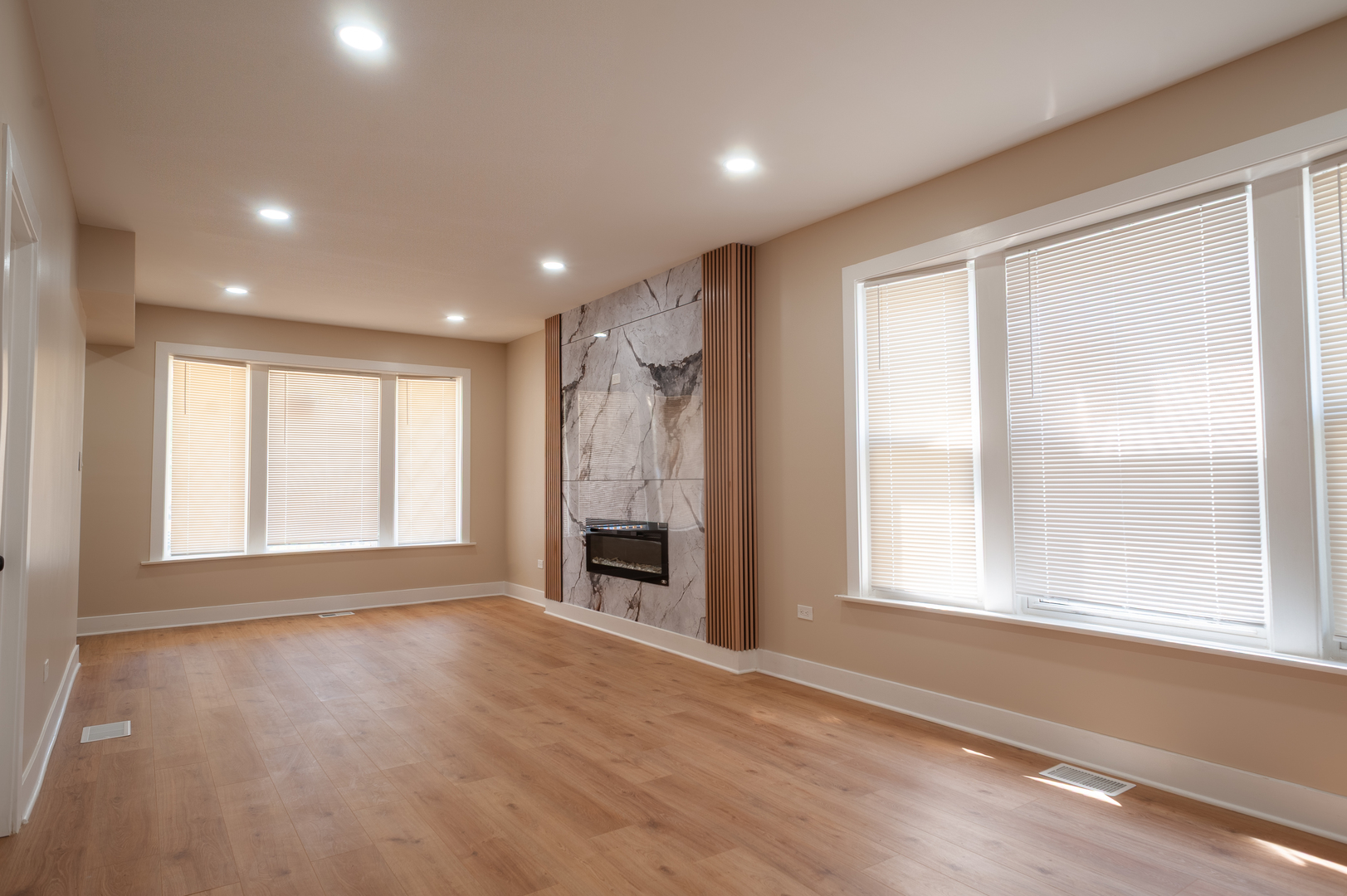 8620 South Union Avenue Chicago, IL 60620 - Photo 12 of 41 a view of an empty room with a window and wooden floor