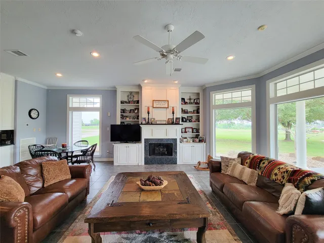 a large kitchen with stainless steel appliances granite countertop a stove a sink and a granite counter tops