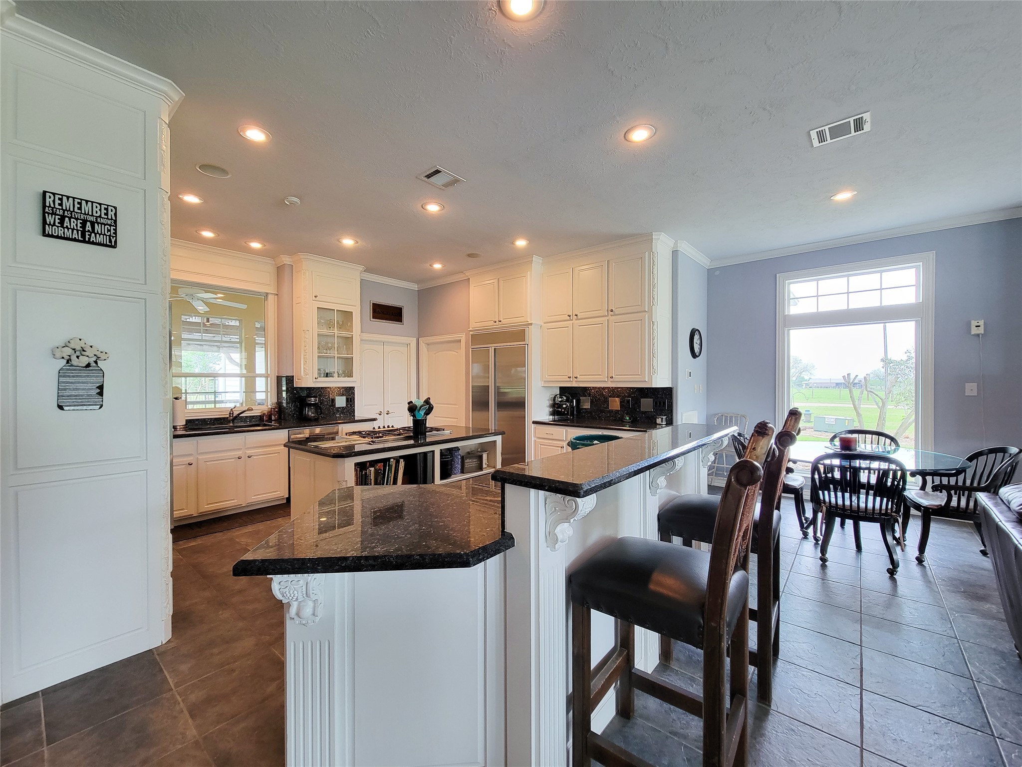 939 Old Nelsonville Road Bellville, TX 77418 - Photo 22 of 50 a kitchen with a dining table chairs and counter top space