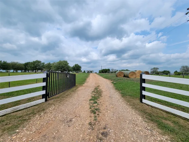 a view of a house with a big yard