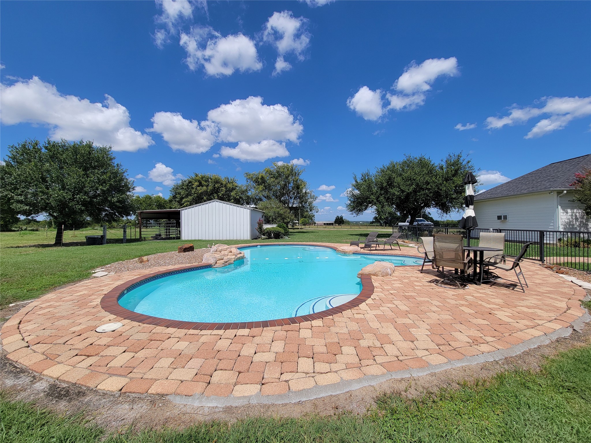 939 Old Nelsonville Road Bellville, TX 77418 - Photo 40 of 50 a view of a backyard with swimming pool