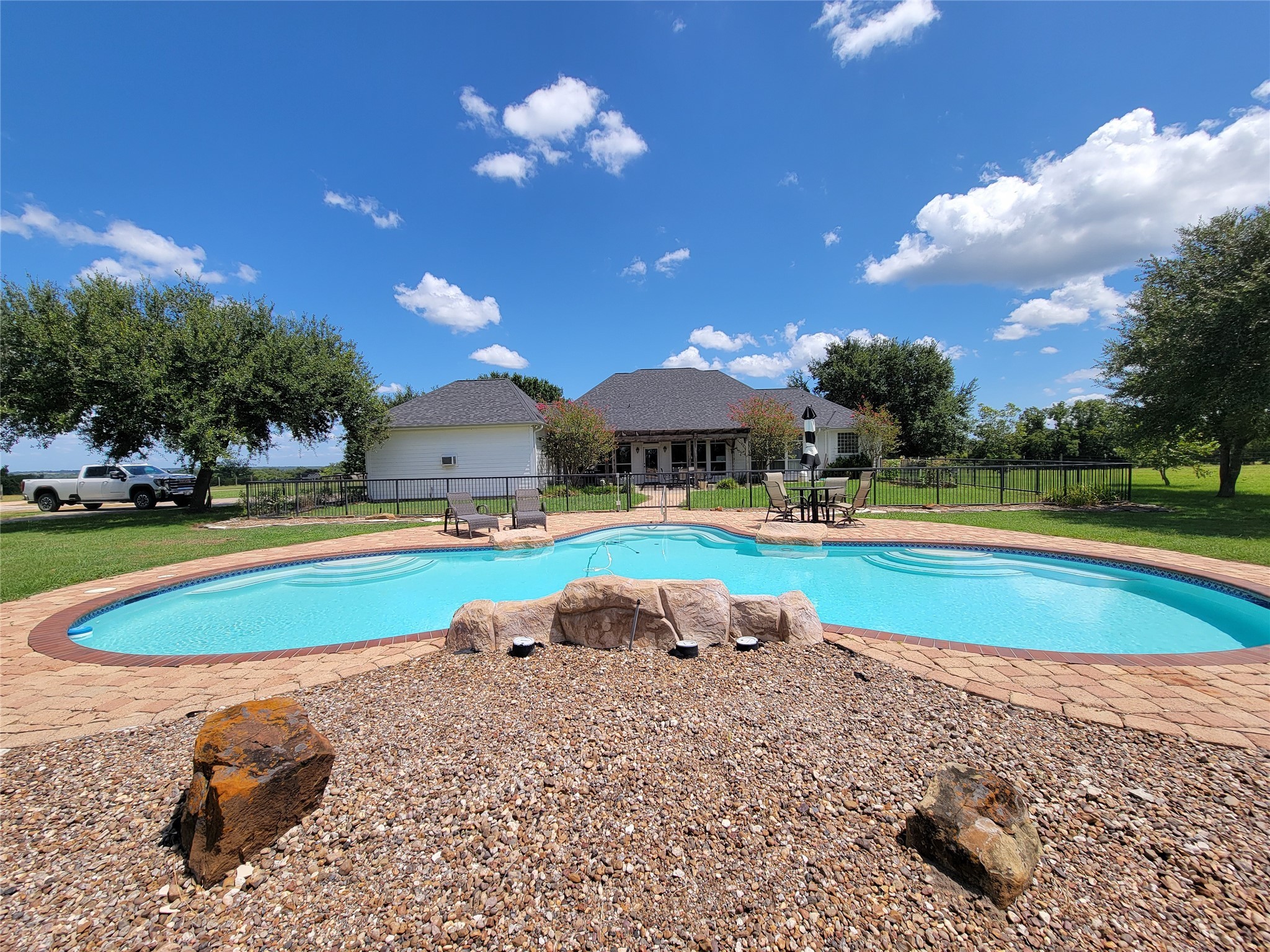 939 Old Nelsonville Road Bellville, TX 77418 - Photo 41 of 50 a view of a swimming pool with a yard and plants