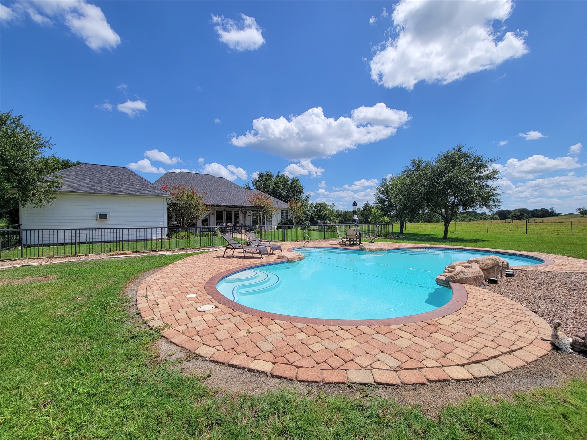 939 Old Nelsonville Road Bellville, TX 77418 - Photo 42 of 50 a view of a swimming pool with a yard