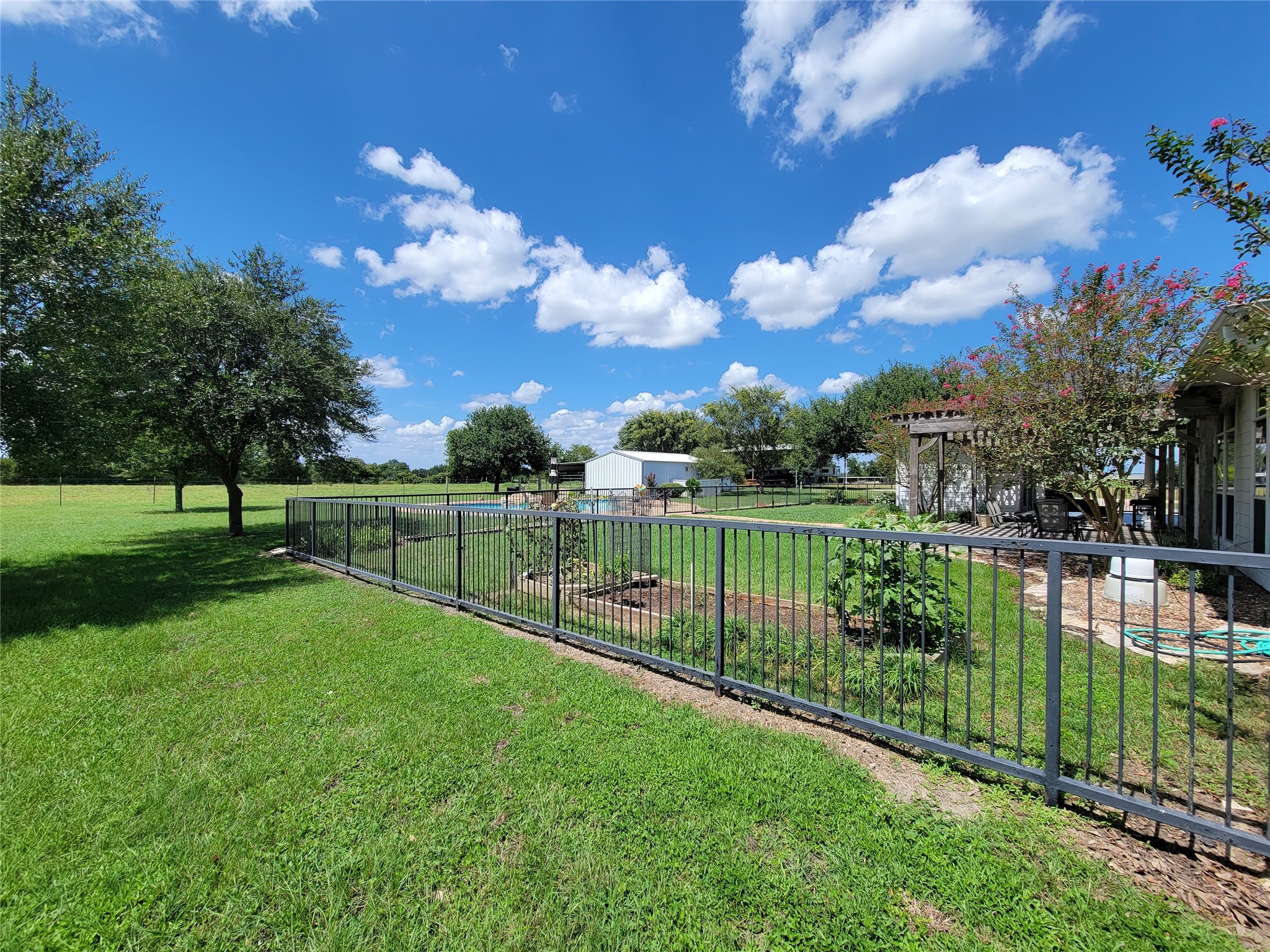 939 Old Nelsonville Road Bellville, TX 77418 - Photo 43 of 50 a view of a golf course with a garden