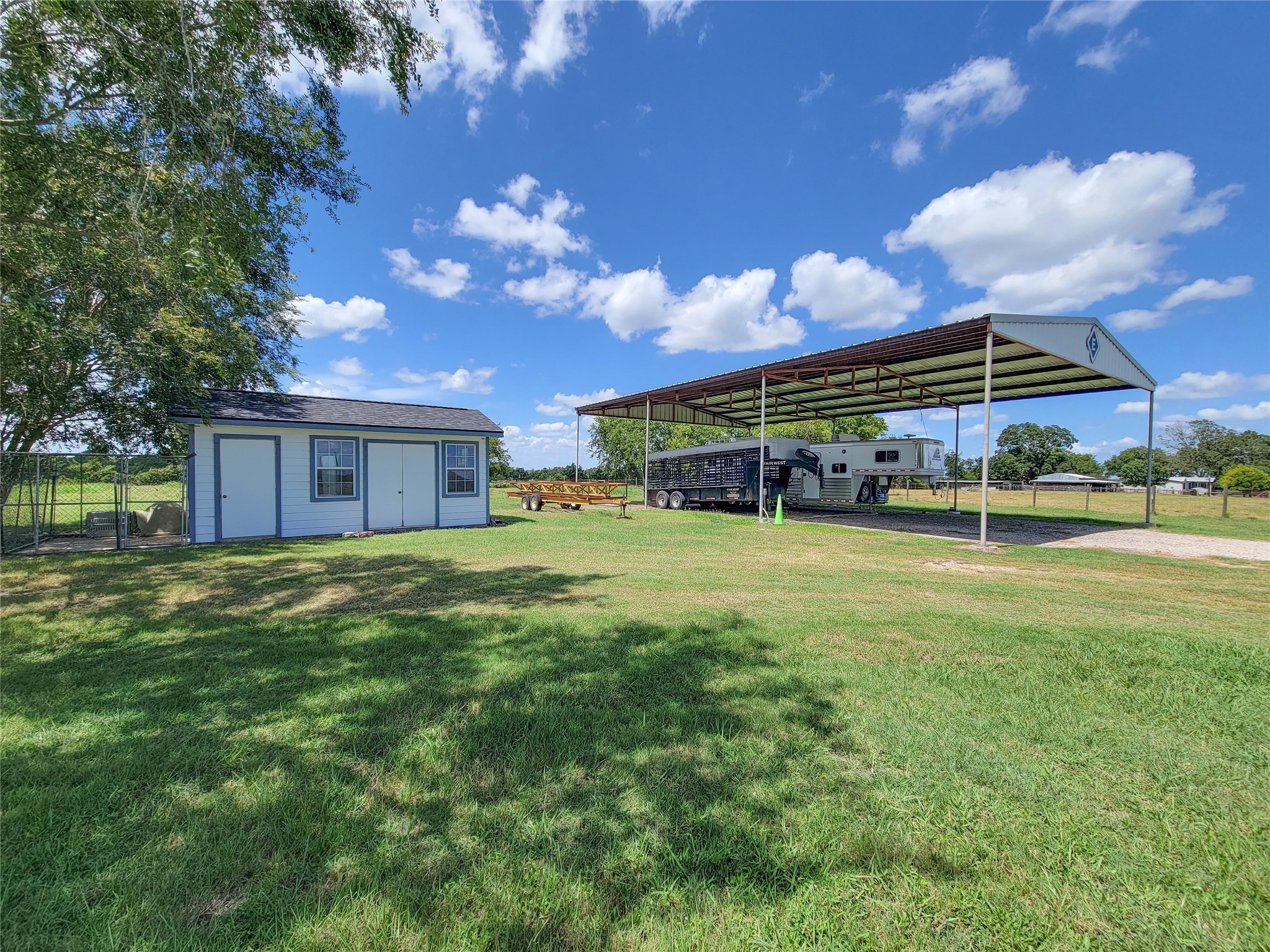 939 Old Nelsonville Road Bellville, TX 77418 - Photo 50 of 50 a view of a house with a big yard and a large tree