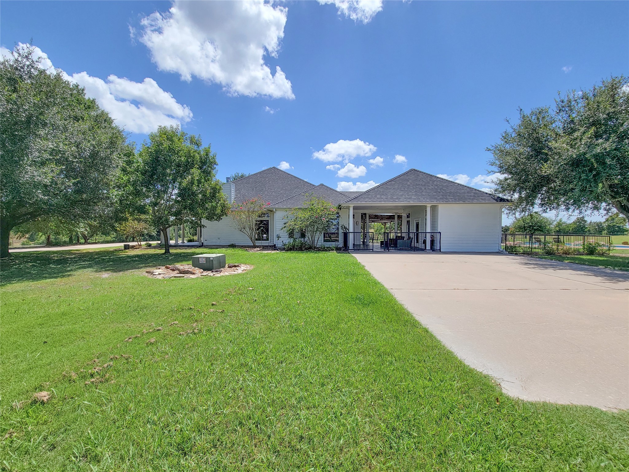 939 Old Nelsonville Road Bellville, TX 77418 - Photo 6 of 50 a view of house with garden and a car park