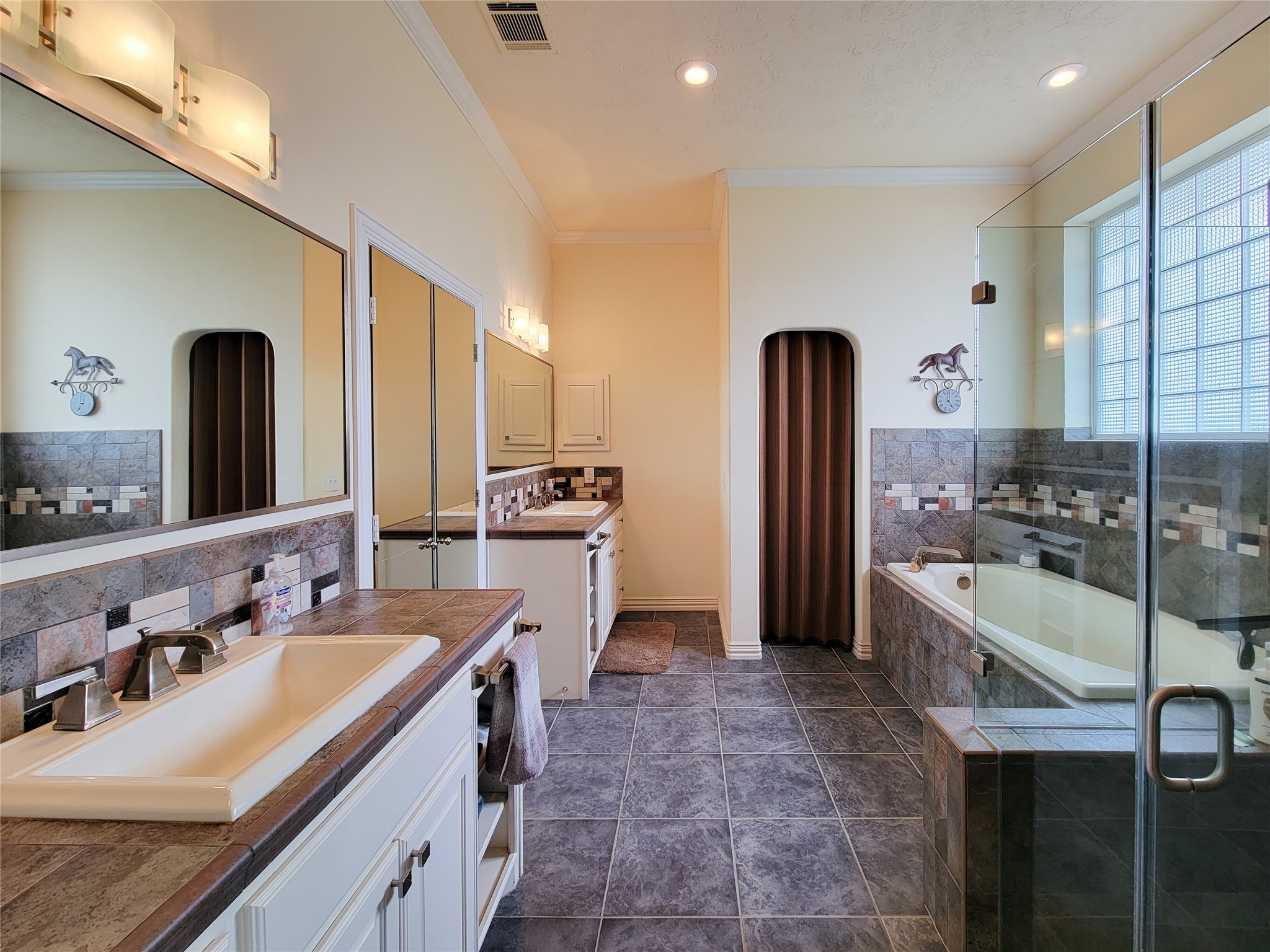 939 Old Nelsonville Road Bellville, TX 77418 - Photo 8 of 50 a large bathroom with a granite countertop double vanity sink a mirror and shower