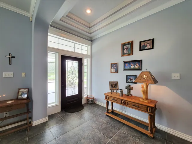 a living room with furniture fireplace and window