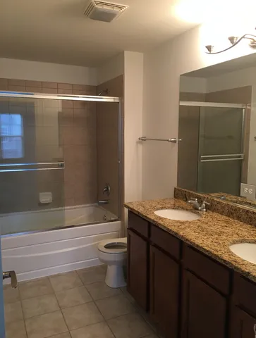 a view of a room with wooden walls