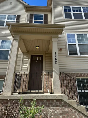 a view of a house with entrance gate