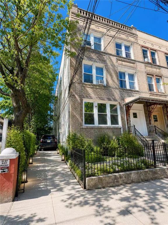 1564 Bay Ridge Avenue Brooklyn, NY 11219 - Photo 1 of 14 a view of a building with garden