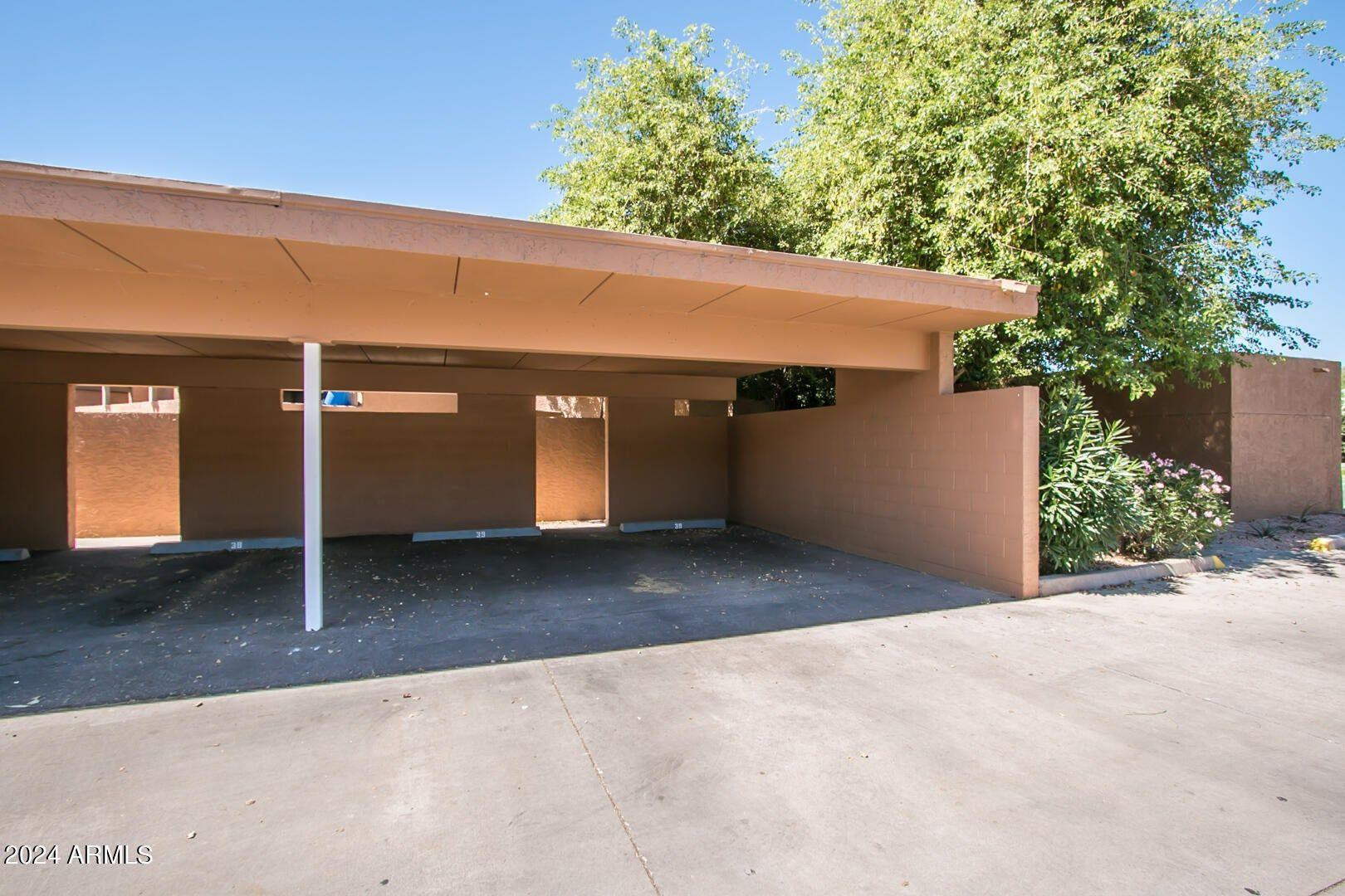 7401 North Scottsdale Road, Unit 3 Paradise Valley, AZ 85253 - Photo 27 of 29 a view of a house with a garage