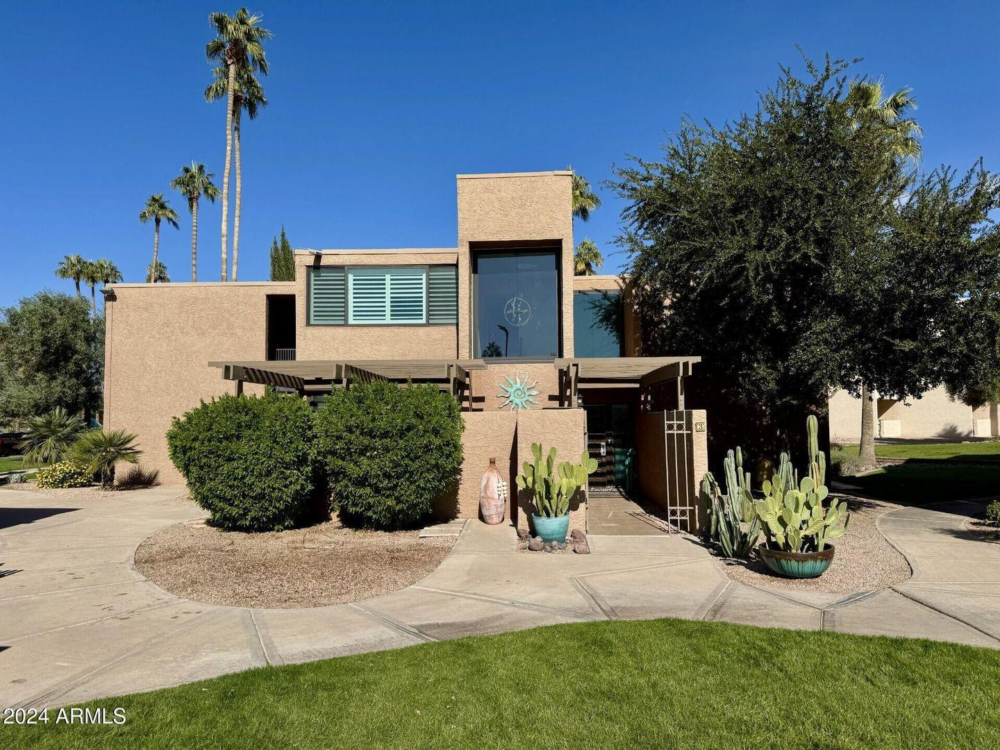 7401 North Scottsdale Road, Unit 3 Paradise Valley, AZ 85253 - Photo 29 of 29 a front view of a house with garden