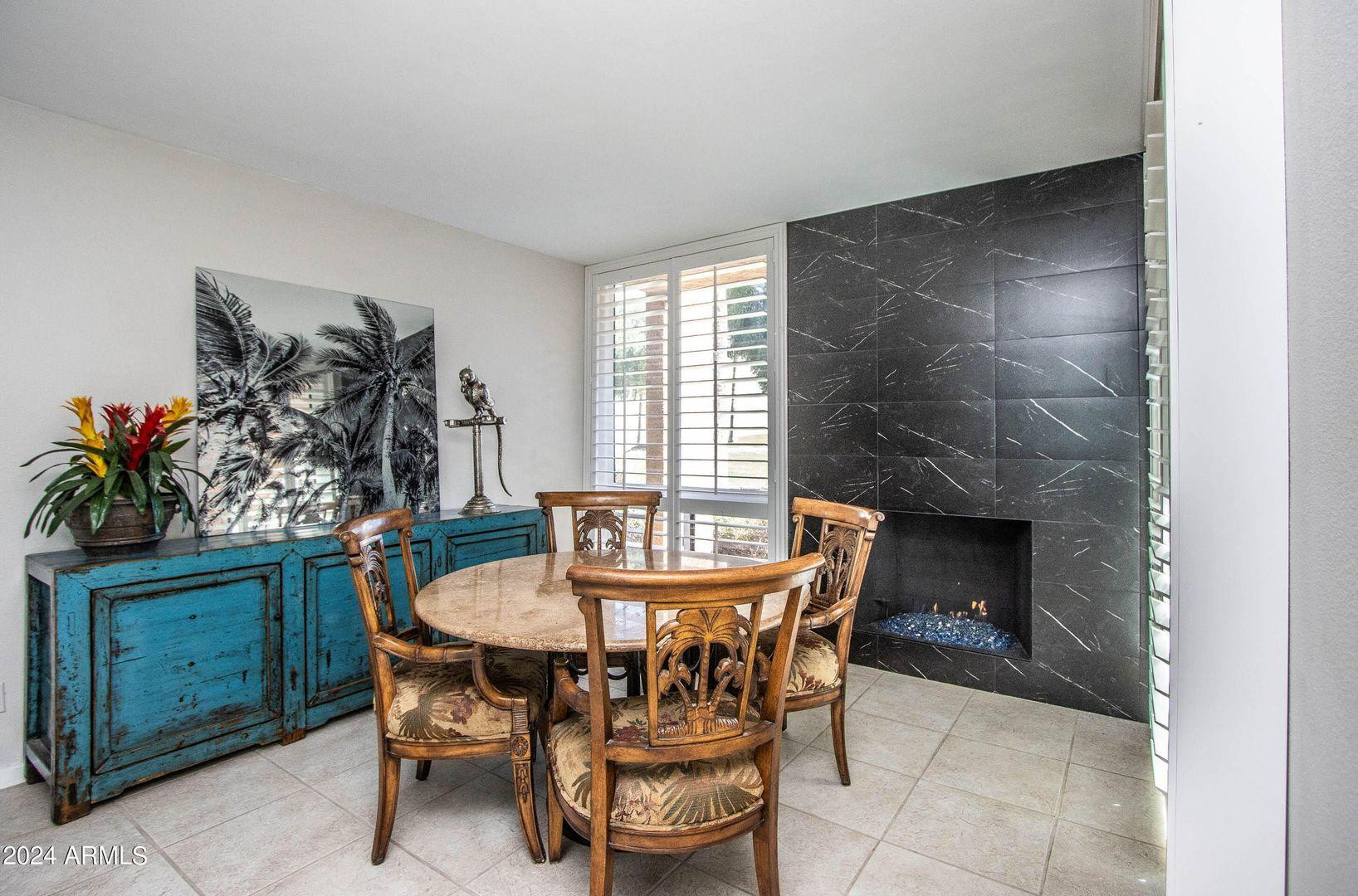 7401 North Scottsdale Road, Unit 3 Paradise Valley, AZ 85253 - Photo 5 of 29 a dining room with furniture and window