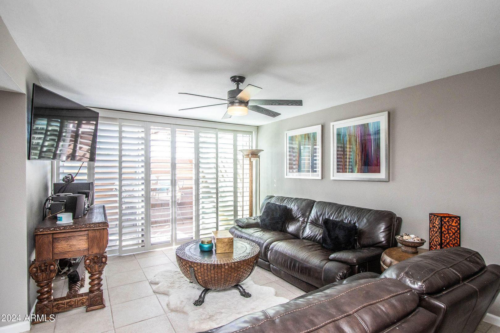 7401 North Scottsdale Road, Unit 3 Paradise Valley, AZ 85253 - Photo 7 of 29 a living room with furniture and a large window